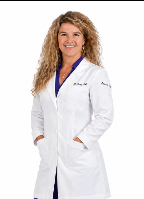 Dr. Wanda Good, DO, in a white coat.